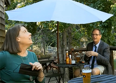 Destiny, Free Will or Luck of the Irish - a woman and a man sitting on a bar terrace